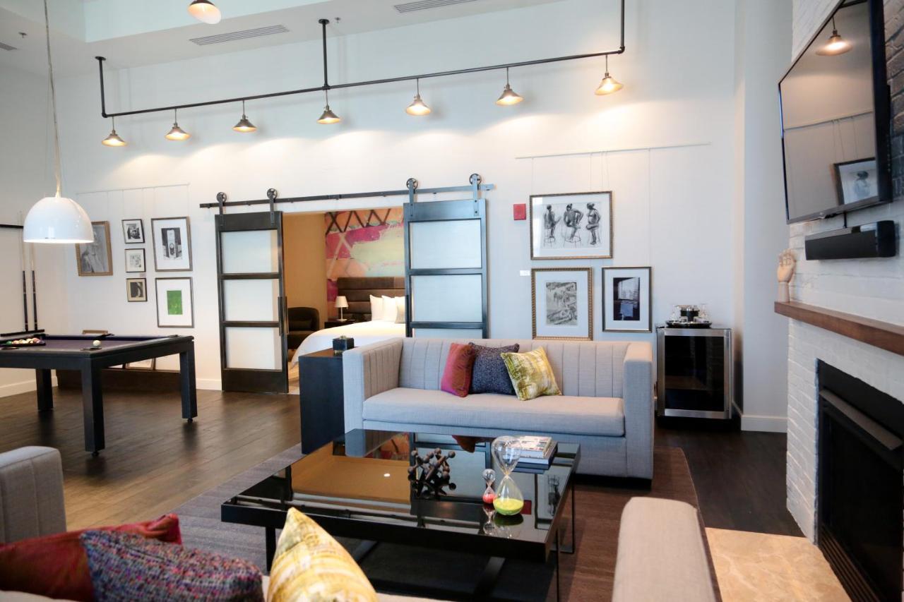 Hotel Commonwealth Бостън Екстериор снимка A living room with a sliding barn door